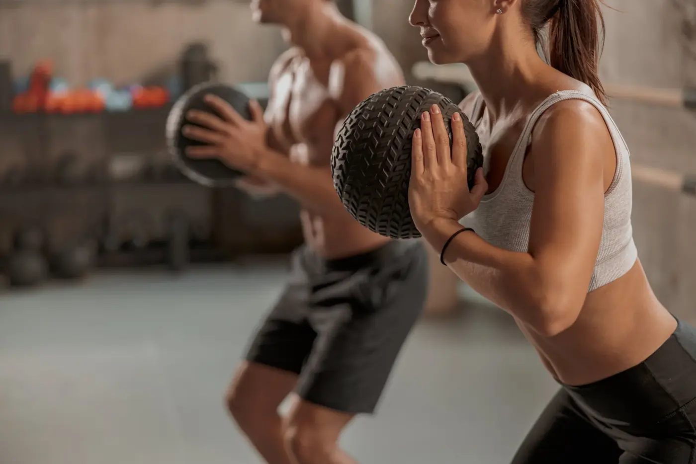 Athletes training with a medicine ball